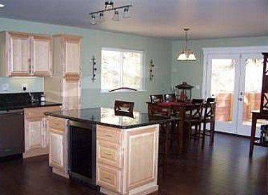 modified PMHI Westlake kitchen and dining area all custom finishes in modified pacific modern homes westlake
