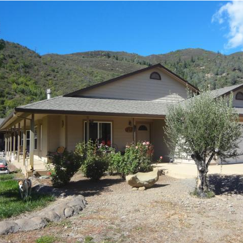 1600 sf Riverbend with large covered porch PMHI Riverbend on a stained concrete slab with a large covered porch